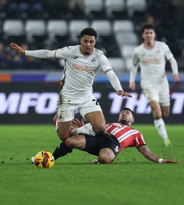 210125  Swansea City v Sheffield United, EFL Sky Bet Championship - Myles Peart-Harris of Swansea City is tackled by Gustavo Hamer of Sheffield United