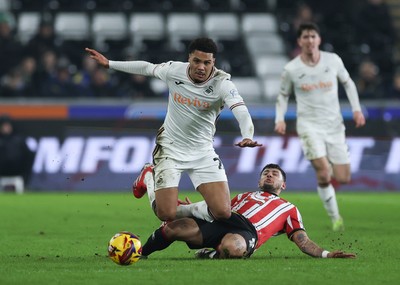 210125  Swansea City v Sheffield United, EFL Sky Bet Championship - Myles Peart-Harris of Swansea City is tackled by Gustavo Hamer of Sheffield United