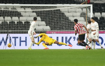 210125  Swansea City v Sheffield United, EFL Sky Bet Championship - Rhian Brewster of Sheffield United beats Swansea City goalkeeper Lawrence Vigouroux to score goal