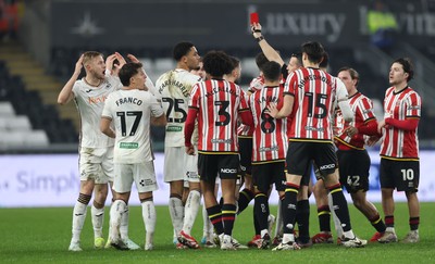 210125  Swansea City v Sheffield United, EFL Sky Bet Championship - Harry Darling of Swansea City, left, is shown a red card by referee Dean Whitestone