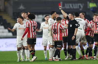 210125  Swansea City v Sheffield United, EFL Sky Bet Championship - Harry Darling of Swansea City, second left, is shown a red card by referee Dean Whitestone