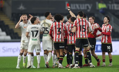 210125  Swansea City v Sheffield United, EFL Sky Bet Championship - Harry Darling of Swansea City, left, is shown a red card by referee Dean Whitestone