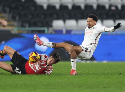 210125  Swansea City v Sheffield United, EFL Sky Bet Championship - Florian Bianchini of Swansea City is tackled by Sydie Peck of Sheffield United