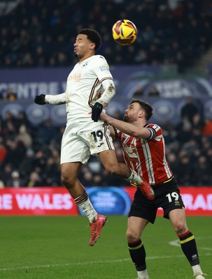 210125  Swansea City v Sheffield United, EFL Sky Bet Championship - Florian Bianchini of Swansea City and Jack Robinson of Sheffield United compete for the ball