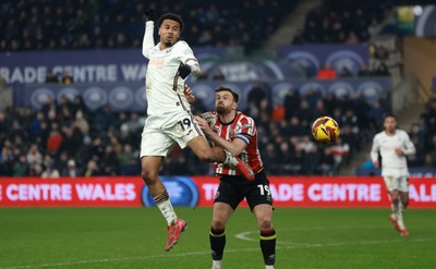 210125  Swansea City v Sheffield United, EFL Sky Bet Championship - Florian Bianchini of Swansea City and Jack Robinson of Sheffield United compete for the ball