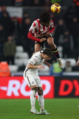 210125  Swansea City v Sheffield United, EFL Sky Bet Championship - Sam McCallum of Sheffield United gets above Goncalo Franco of Swansea City to head the ball