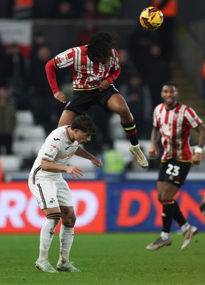 210125  Swansea City v Sheffield United, EFL Sky Bet Championship - Sam McCallum of Sheffield United gets above Goncalo Franco of Swansea City to head the ball