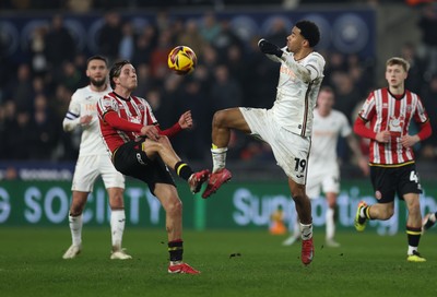 210125  Swansea City v Sheffield United, EFL Sky Bet Championship - Florian Bianchini of Swansea City and Sydie Peck of Sheffield United compete for the ball