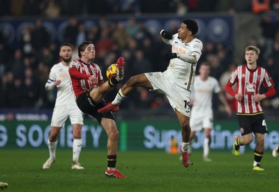 210125  Swansea City v Sheffield United, EFL Sky Bet Championship - Florian Bianchini of Swansea City and Sydie Peck of Sheffield United compete for the ball