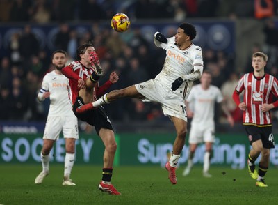 210125  Swansea City v Sheffield United, EFL Sky Bet Championship - Florian Bianchini of Swansea City and Sydie Peck of Sheffield United compete for the ball