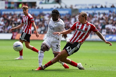 220826 - Swansea City v Sheffield United - Sky Bet Championship - Sydie Peck of Sheffield United tackles Joseph Opoku of Swansea City