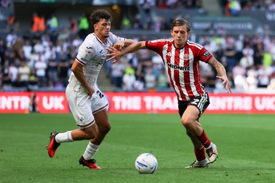 220826 - Swansea City v Sheffield United - Sky Bet Championship - Filip Lissah of Swansea City and Sydie Peck of Sheffield United battle for the ball