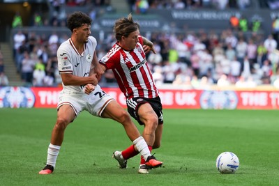 220826 - Swansea City v Sheffield United - Sky Bet Championship - Filip Lissah of Swansea City and Sydie Peck of Sheffield United battle for the ball