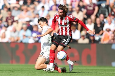 220826 - Swansea City v Sheffield United - Sky Bet Championship - Joe Rothwell of Sheffield United fouls Elijah Just of Swansea City