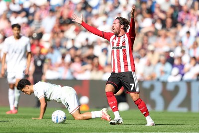 220826 - Swansea City v Sheffield United - Sky Bet Championship - Joe Rothwell of Sheffield United reacts to fouling Elijah Just of Swansea City