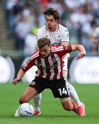 220826 - Swansea City v Sheffield United - Sky Bet Championship - Josh Key of Swansea City fouls Harrison Burrows of Sheffield United 