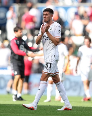 220826 - Swansea City v Sheffield United - Sky Bet Championship - Ross Stewart of Swansea City applauds fans at full time 