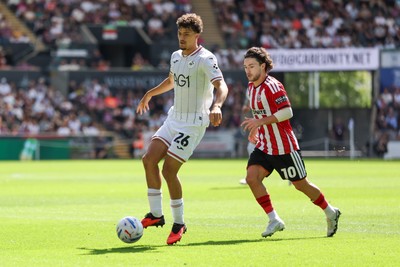 220826 - Swansea City v Sheffield United - Sky Bet Championship - Filip Lissah of Swansea City attacks with pressure from Callum O'Hare of Sheffield United 