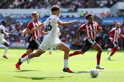 220826 - Swansea City v Sheffield United - Sky Bet Championship - Filip Lissah of Swansea City attacks with pressure from Harrison Burrows (L) and Sam McCallum of Sheffield United (R)
