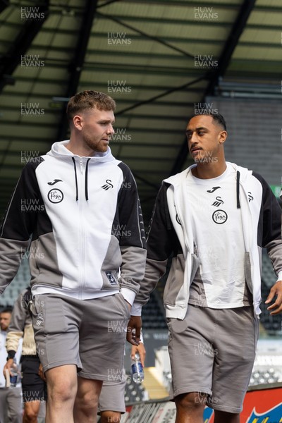 220826 - Swansea City v Sheffield United - Sky Bet Championship - Andy Fisher (L) and Adam Idah of Swansea City (R) arrive 
