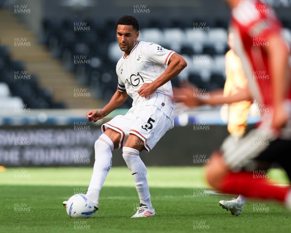 220826 - Swansea City v Sheffield United - Sky Bet Championship - Ben Cabango of Swansea City passes the ball