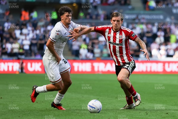 220826 - Swansea City v Sheffield United - Sky Bet Championship - Filip Lissah of Swansea City and Sydie Peck of Sheffield United battle for the ball