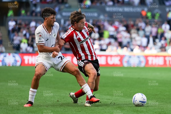 220826 - Swansea City v Sheffield United - Sky Bet Championship - Filip Lissah of Swansea City and Sydie Peck of Sheffield United battle for the ball