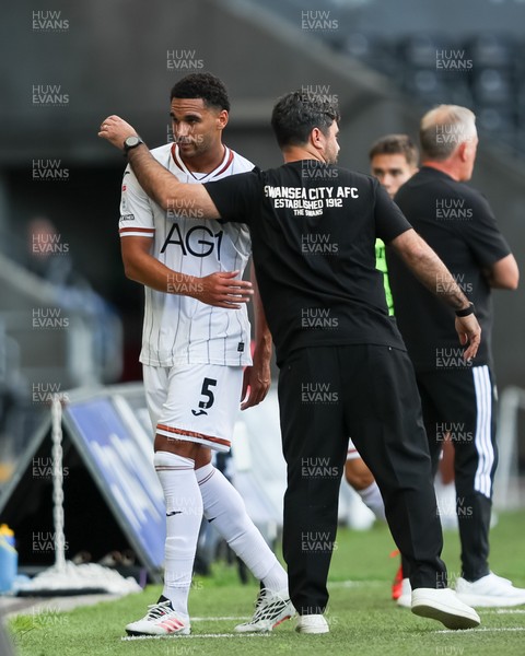 220826 - Swansea City v Sheffield United - Sky Bet Championship - Vítor Matos Manager of Swansea City hugs Ben Cabango of Swansea City as he’s substituted off