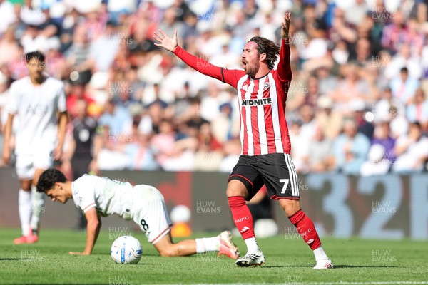 220826 - Swansea City v Sheffield United - Sky Bet Championship - Joe Rothwell of Sheffield United reacts to fouling Elijah Just of Swansea City