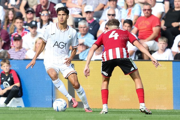 220826 - Swansea City v Sheffield United - Sky Bet Championship - Marko Stamenic of Swansea City takes on Oliver Arblaster of Sheffield United 