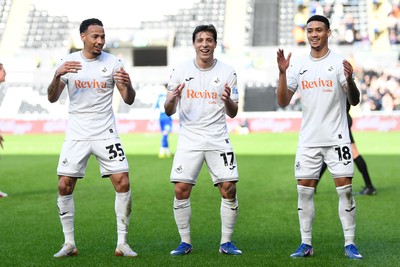 080226 - Swansea City v Sheffield Wednesday - Sky Bet Championship - Goncalo Franco of Swansea City celebrates scoring a goal with Ronald (left) and Gustavo Nunes (right0