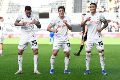 080226 - Swansea City v Sheffield Wednesday - Sky Bet Championship - Goncalo Franco of Swansea City celebrates scoring a goal with Ronald (left) and Gustavo Nunes (right0