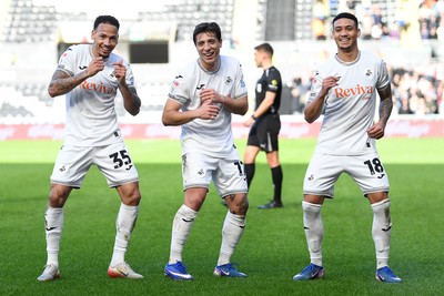 080226 - Swansea City v Sheffield Wednesday - Sky Bet Championship - Goncalo Franco of Swansea City celebrates scoring a goal with Ronald (left) and Gustavo Nunes (right0