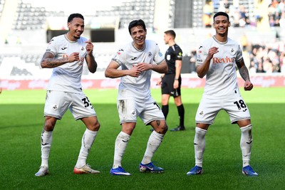 080226 - Swansea City v Sheffield Wednesday - Sky Bet Championship - Goncalo Franco of Swansea City celebrates scoring a goal with Ronald (left) and Gustavo Nunes (right0
