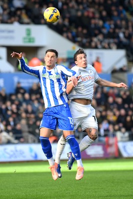 080226 - Swansea City v Sheffield Wednesday - Sky Bet Championship - Goncalo Franco of Swansea City is challenged by Jerry Yates Sheffield Wednesday