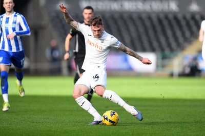 080226 - Swansea City v Sheffield Wednesday - Sky Bet Championship - Josh Tymon of Swansea City has a shot from distance
