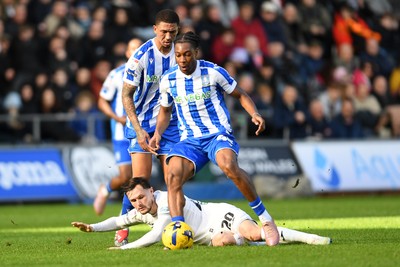 080226 - Swansea City v Sheffield Wednesday - Sky Bet Championship - Liam Cullen of Swansea City is tackled by Liam Palmer Sheffield Wednesday