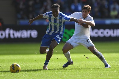 080226 - Swansea City v Sheffield Wednesday - Sky Bet Championship - Goncalo Franco of Swansea City is challenged by Tayo Adaramola Sheffield Wednesday