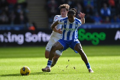 080226 - Swansea City v Sheffield Wednesday - Sky Bet Championship - Goncalo Franco of Swansea City is challenged by Tayo Adaramola Sheffield Wednesday