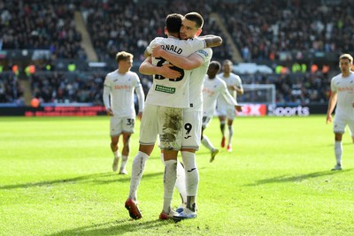 080226 - Swansea City v Sheffield Wednesday - Sky Bet Championship - Zan Vipotnik of Swansea City celebrates scoring a goal with Ronald of Swansea City
