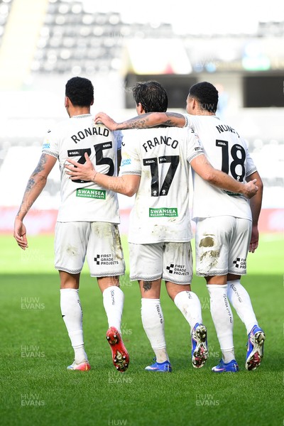 080226 - Swansea City v Sheffield Wednesday - Sky Bet Championship - Goncalo Franco of Swansea City celebrates scoring a goal with Ronald (left) and Gustavo Nunes (right0