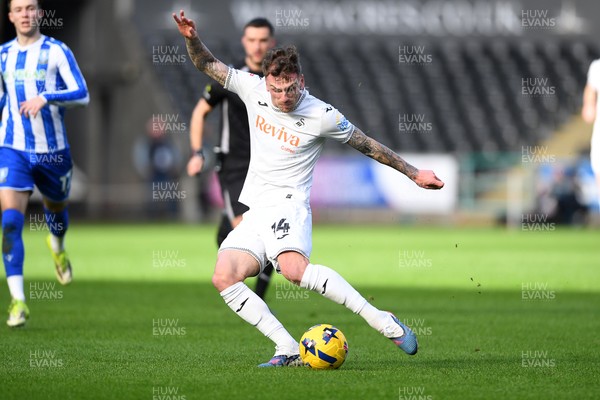 080226 - Swansea City v Sheffield Wednesday - Sky Bet Championship - Josh Tymon of Swansea City has a shot from distance