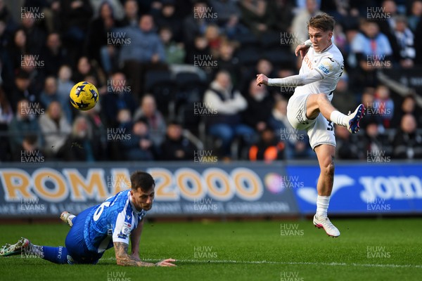 080226 - Swansea City v Sheffield Wednesday - Sky Bet Championship - Ethan Galbraith of Swansea City hits a volley fro distance