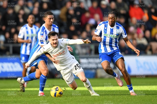 080226 - Swansea City v Sheffield Wednesday - Sky Bet Championship - Liam Cullen of Swansea City is tackled by Liam Palmer Sheffield Wednesday