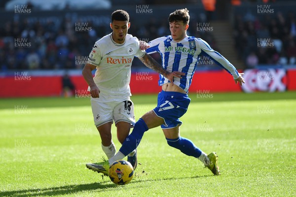 080226 - Swansea City v Sheffield Wednesday - Sky Bet Championship - Gustavo Nunes of Swansea City is challenged by Charlie McNeill of Sheffield Wednesday