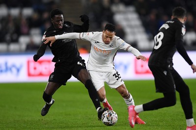 120225 - Swansea City v Sheffield Wednesday - Sky Bet Championship - Ronald of Swansea City is challenged by Djeidi Gassama of Sheffield Wednesday