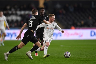 120225 - Swansea City v Sheffield Wednesday - Sky Bet Championship - Lewis O'Brien of Swansea City is challenged by Svante Ingelsson of Sheffield Wednesday