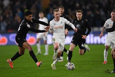 120225 - Swansea City v Sheffield Wednesday - Sky Bet Championship - Lewis O'Brien of Swansea City is challenged by Shea Charles of Sheffield Wednesday