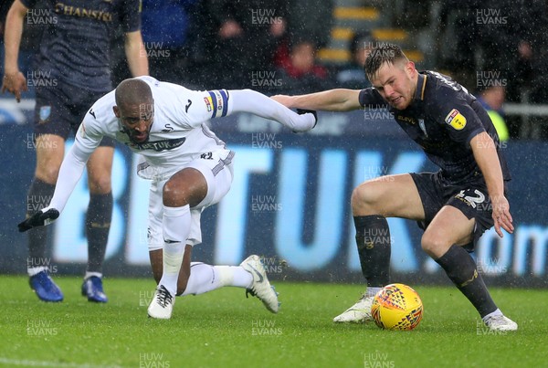 151218 - Swansea City v Sheffield Wednesday - SkyBet Championship - Leroy Fer of Swansea City is tackled by Jordan Thorniley of Sheffield Wednesday