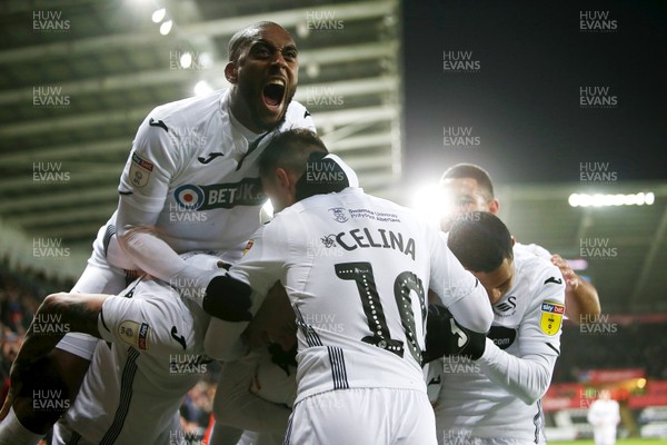 151218 - Swansea City v Sheffield Wednesday - SkyBet Championship - Wayne Routledge of Swansea City celebrates scoring a goal with team mates with Leroy Fer cheering towards the fans